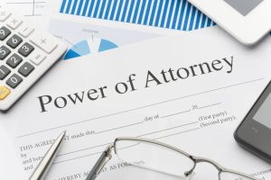 Blank power of attorney form with paperwork