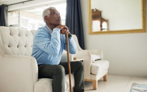 Elderly Man Sitting on Couch